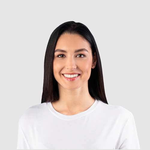 woman with dark hair smiling to the camera