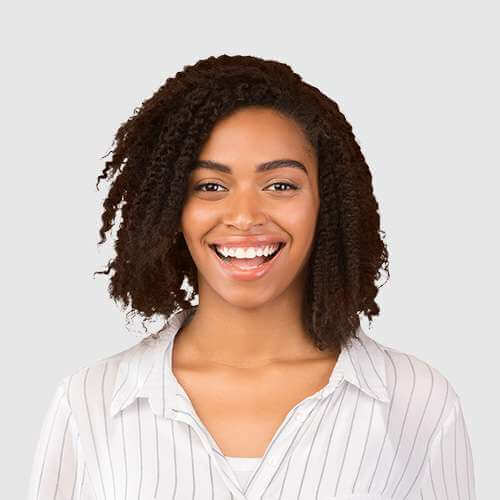 girl with brown hair smiling to the camera